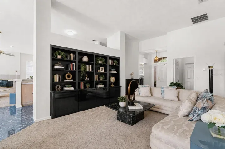 Formal living room with built-in book shelf
