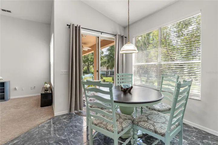Breakfast area with sliding glass doors that lead to the covered porch