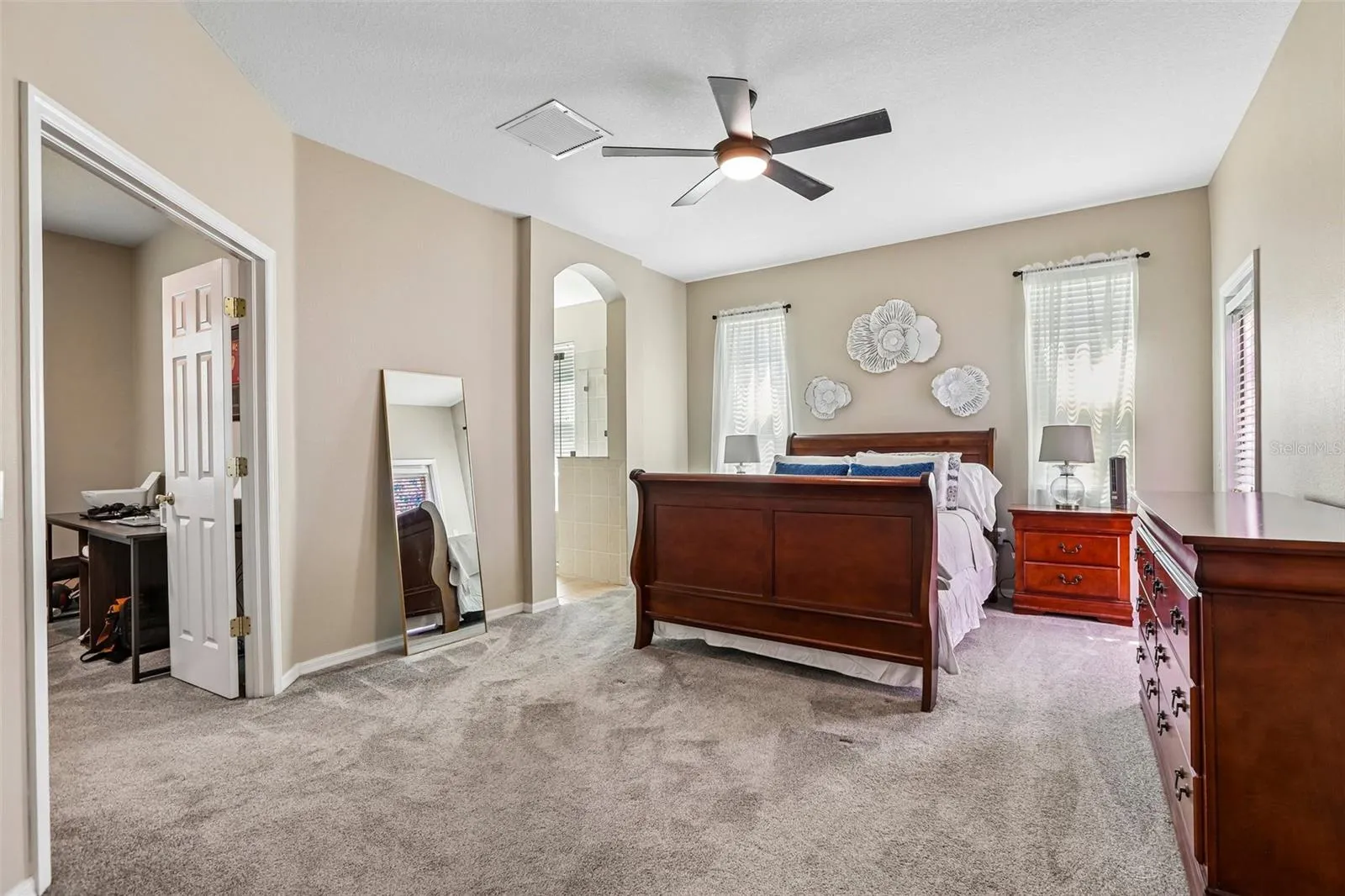 Primary Bedroom with view to Office and Primary Bathroom