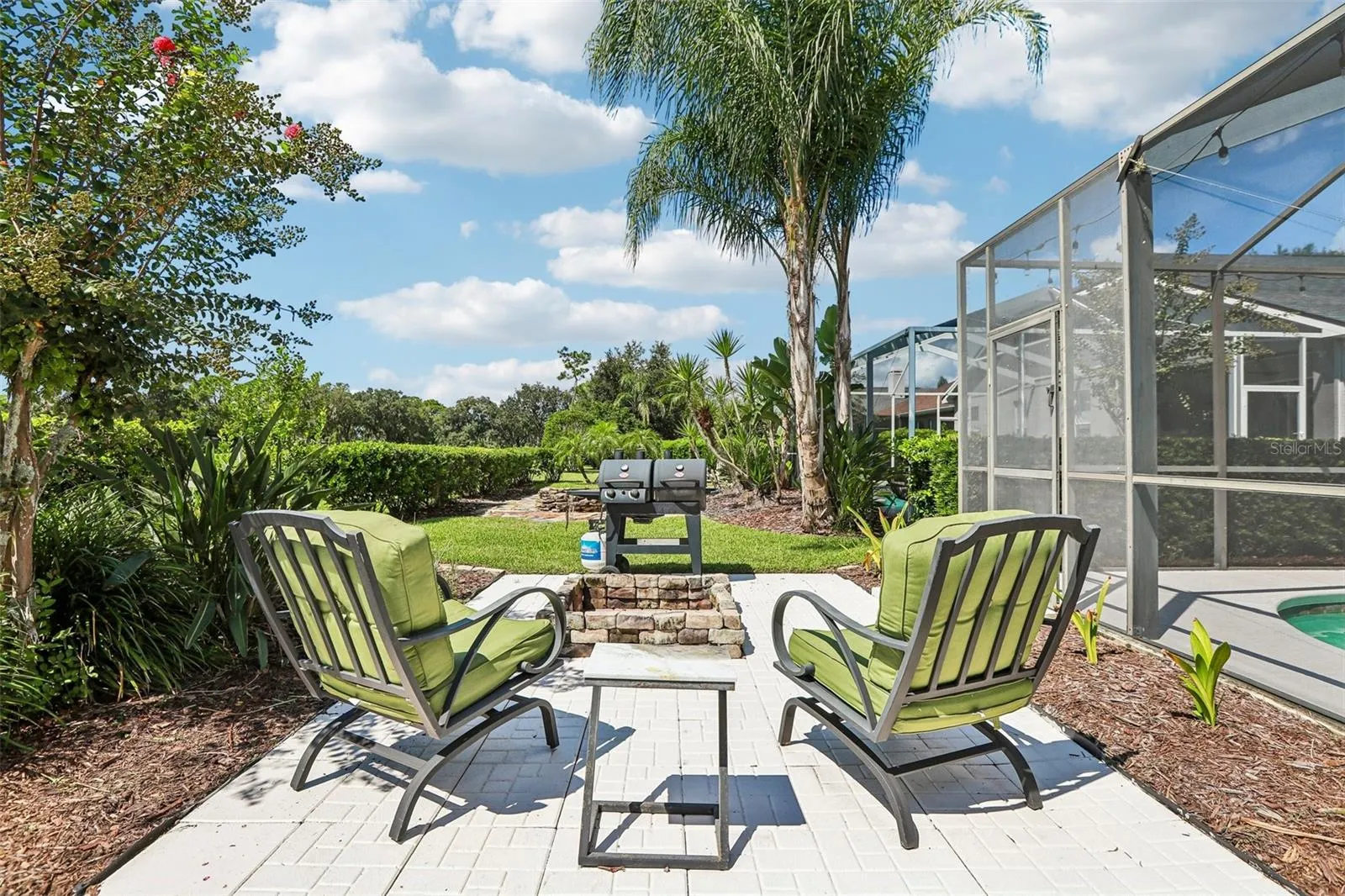 Rear view of home with fire pit and outdoor entertainment center