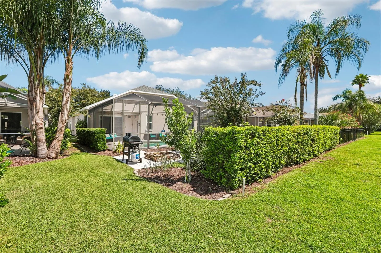 Rear view of home with fire pit and outdoor entertainment center