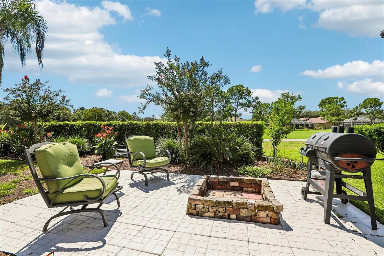 Rear view of home with fire pit and outdoor entertainment center