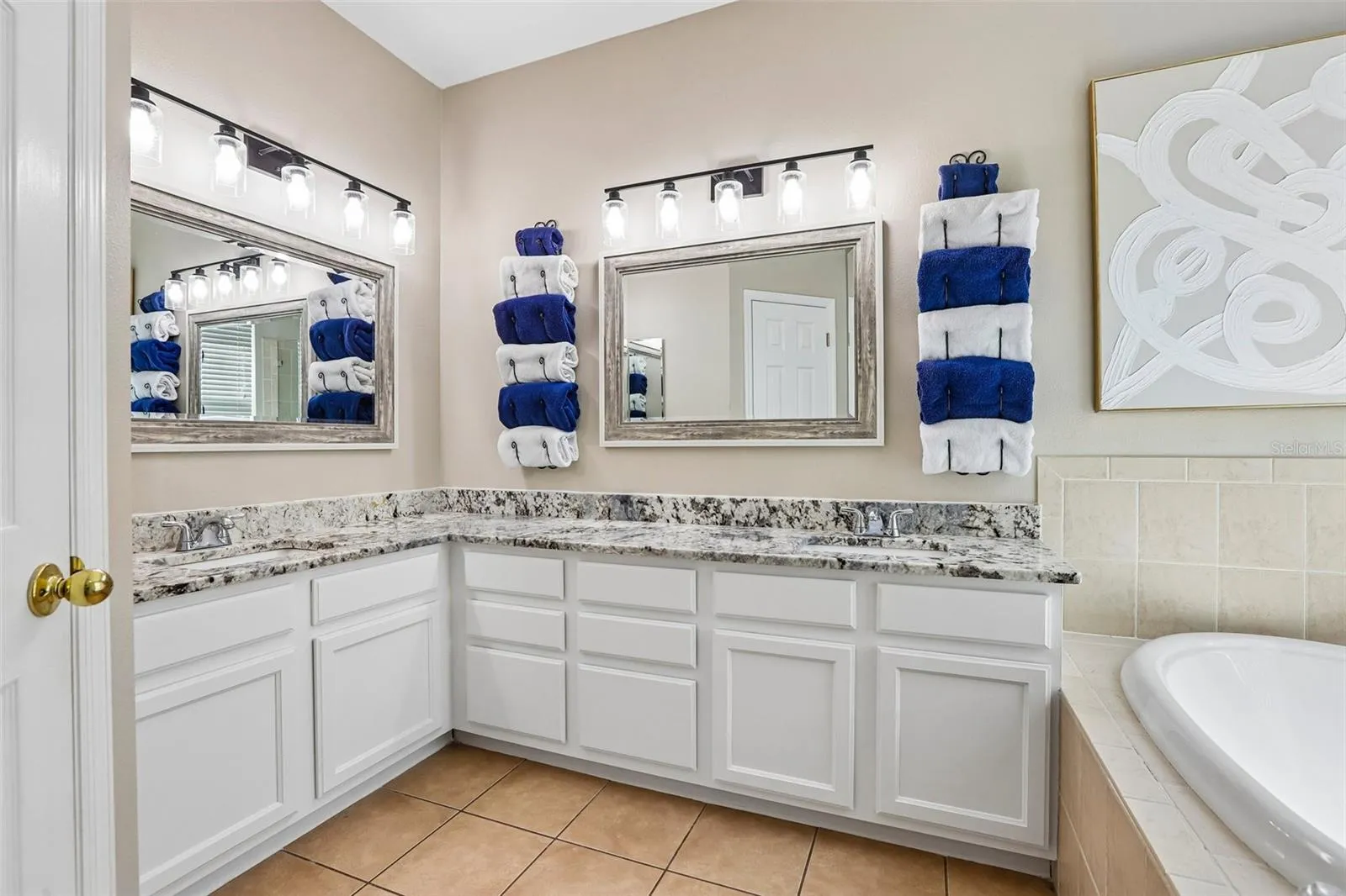 Primary Bathoom with beautiful granite and seam less shower glass