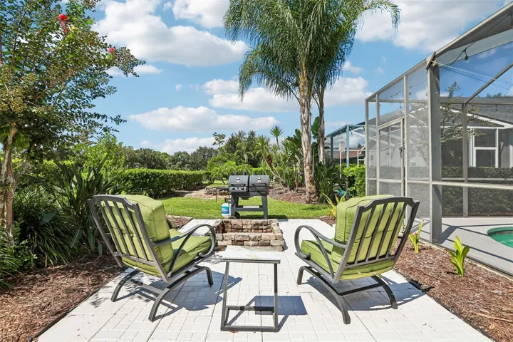 Rear view of home with fire pit and outdoor entertainment center