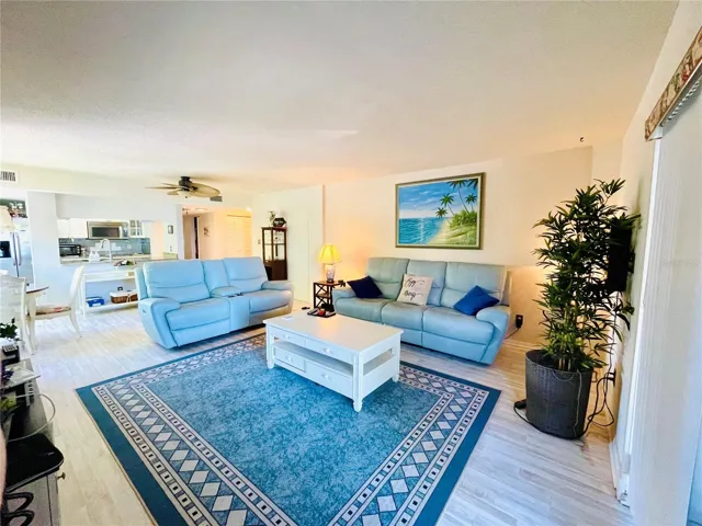 Open Living area with access to sliders to balcony