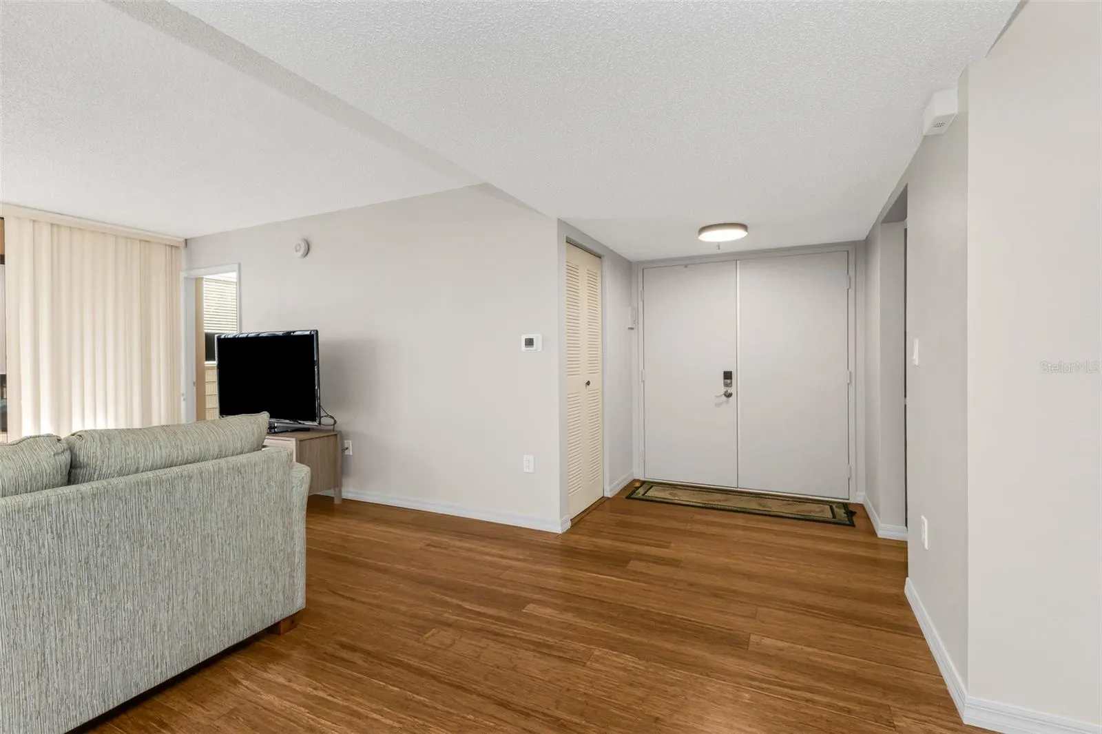 Foyer with laundry room off to the side
