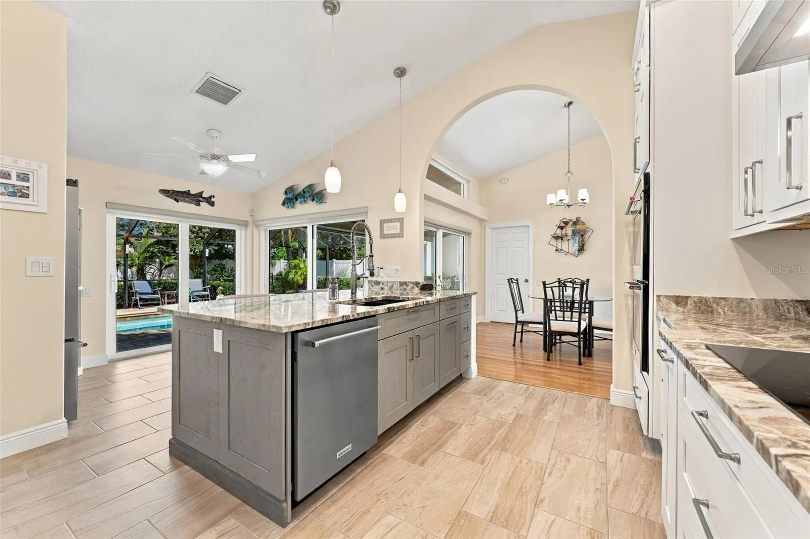 Oversized Kitchen Island Showcasing Beautiful Fantasy Brown Granite Countertops