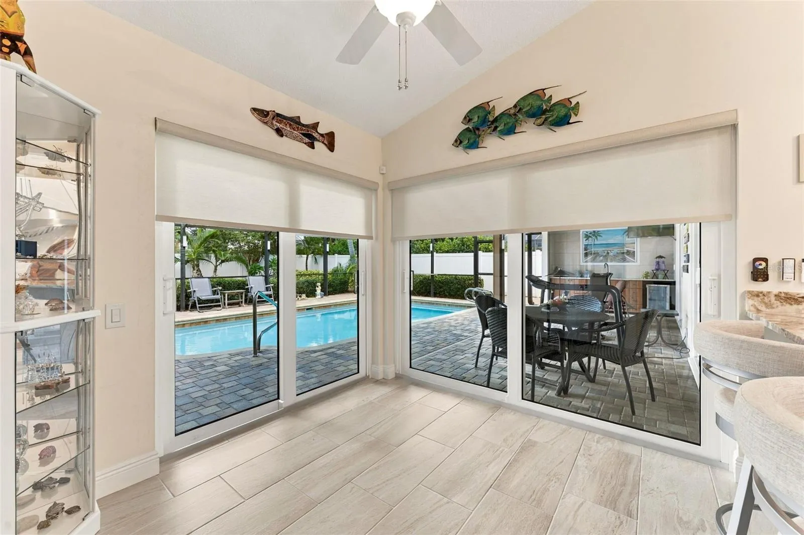 Sun-Filled Breakfast Nook with Impact Glass Sliders to the Pool Area