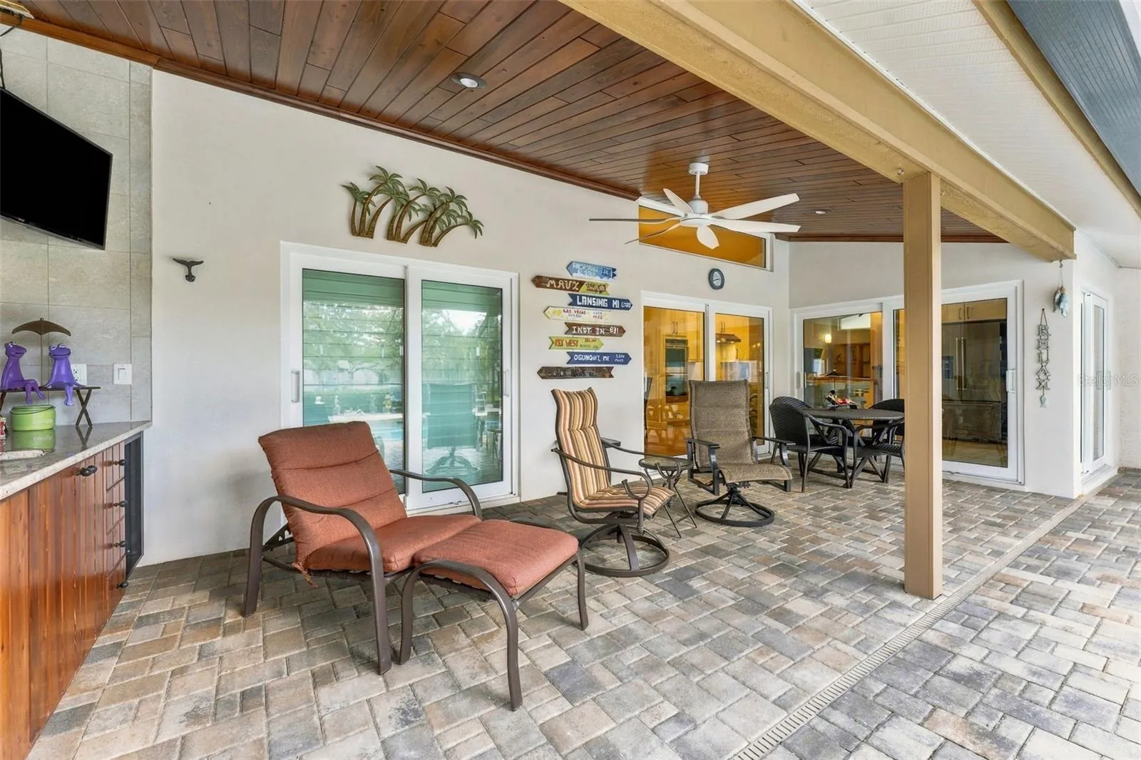 Covered Poolside Living Area Perfect for Lounging, Dining & Entertaining