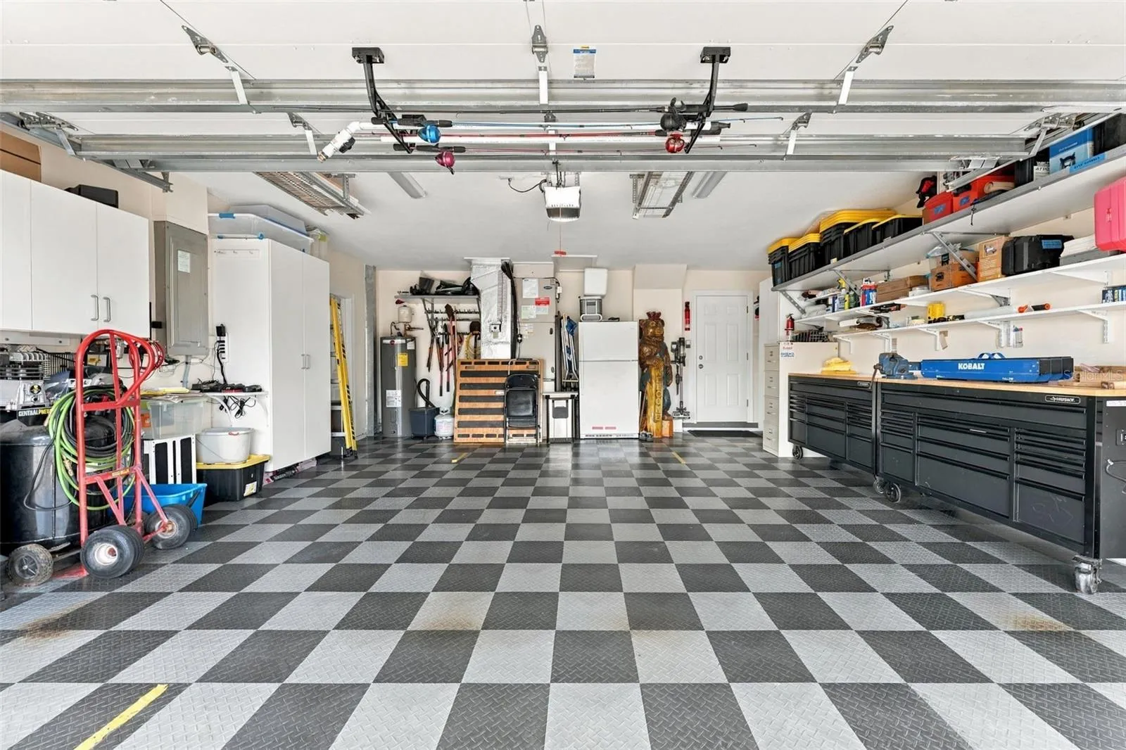 Finished Two-Car Garage with Interlocking Flooring, Storage Cabinetry & Heavy-Duty Shelving