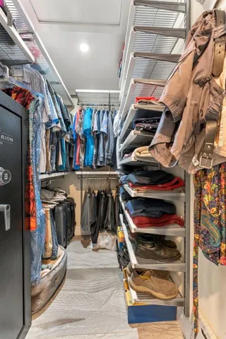 Walk-In Primary Closet with Custom Organization & Ample Storage