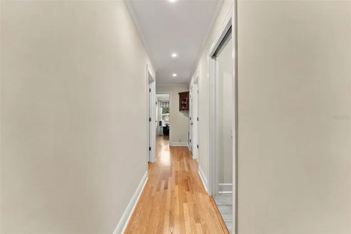 Hallway Leading to Three Additional Bedrooms & Full Bath