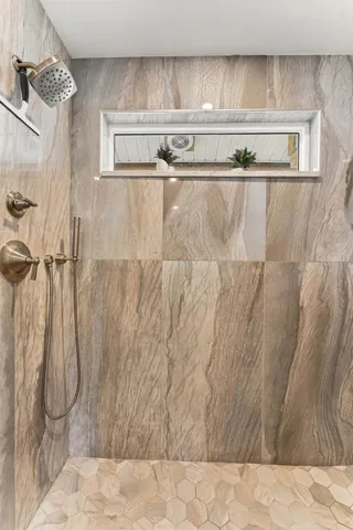 Beautiful Glass-Enclosed Walk-In Shower with Upscale Finishes