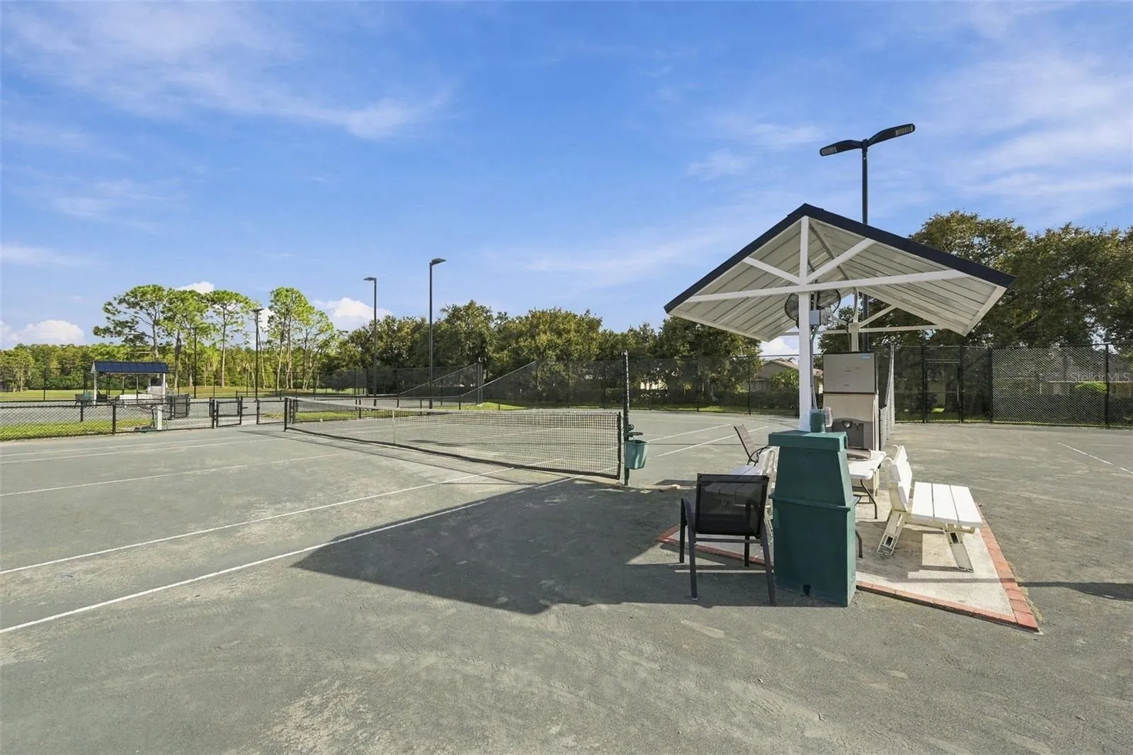 Newly rebuilt tennis courts with updated lighting