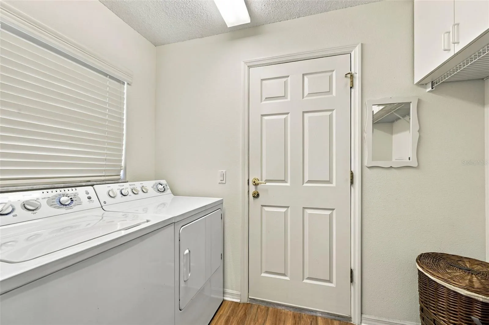 Laund room off kitchen area leading to garage