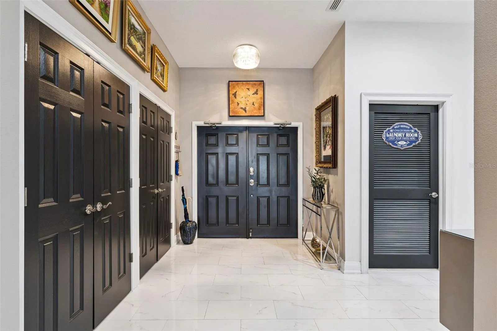 Foyer of residence with double custom closets.