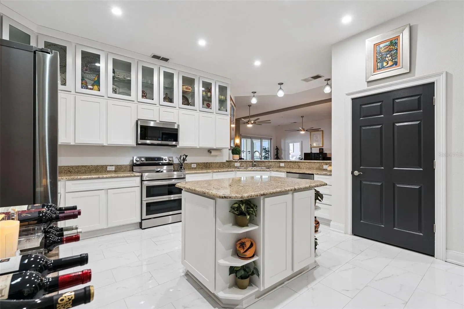 Kitchen island. Oversized pantry with electrical outlet.
