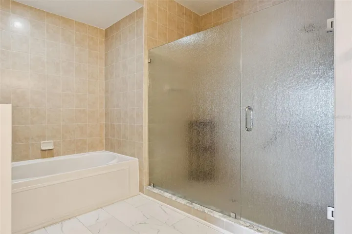 Primary updated shower and tub.