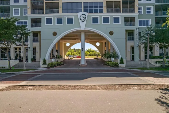 Portico with secure lobbies on either side. Retail on bottom floor.