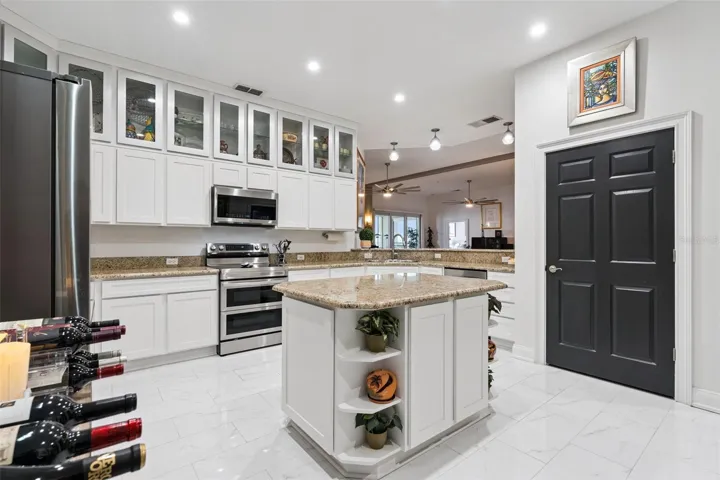 Kitchen island. Oversized pantry with electrical outlet.