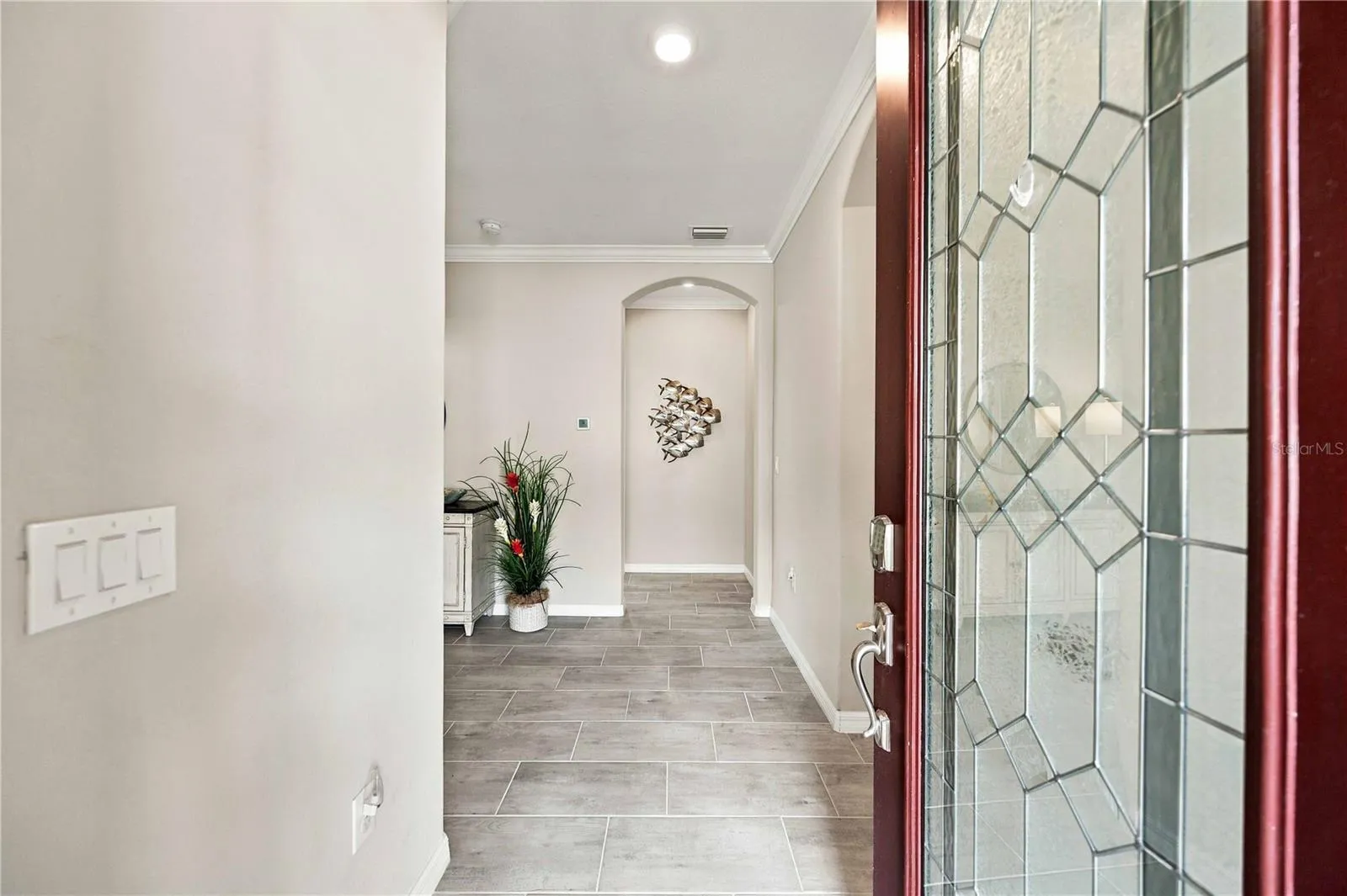 The front door is code/key access and the small side porch entry keeps packages safe and dry.