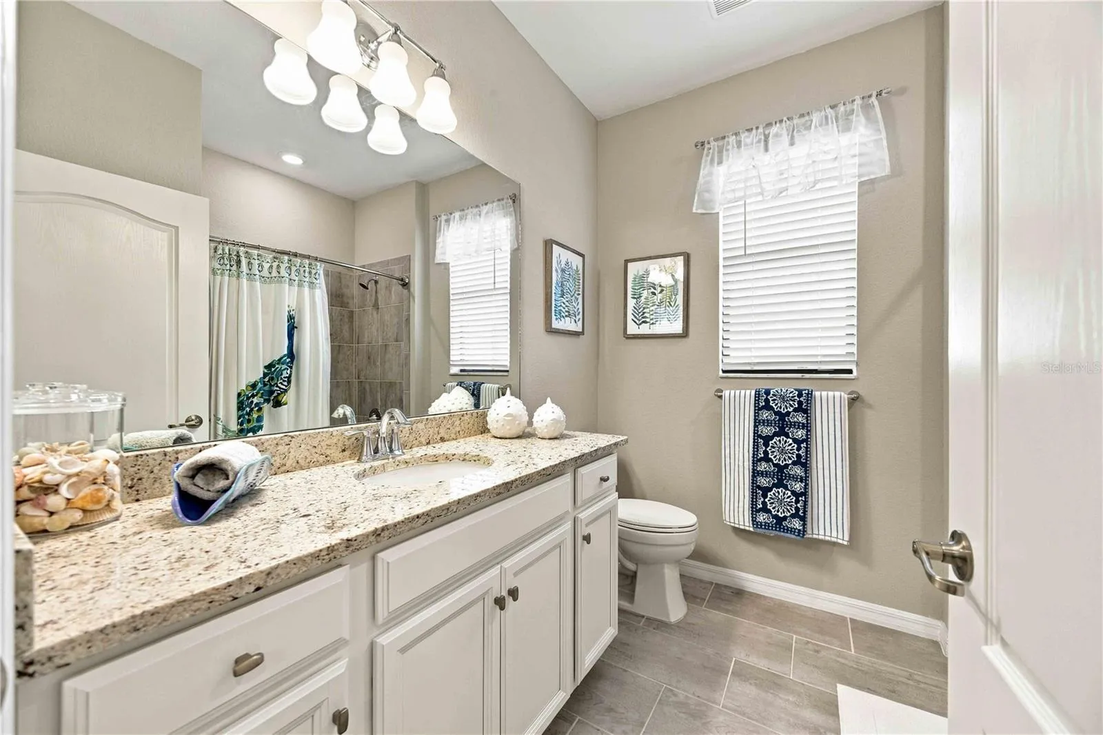 The guest bath is large, welcoming to guests and easy to manuever in.