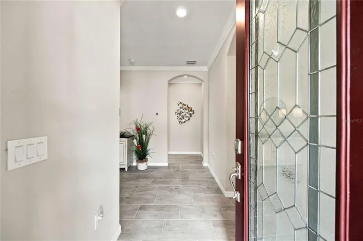 The front door is code/key access and the small side porch entry keeps packages safe and dry.