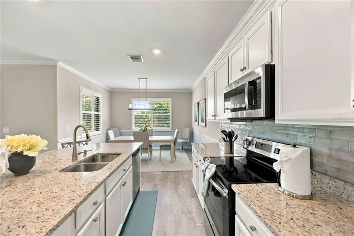 The kitchen is great, pantry, stove, center island, long walkway - the home is gently lived in.