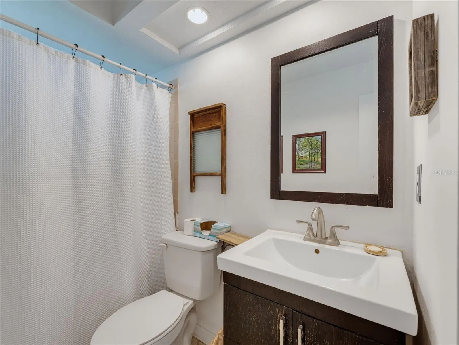 SECONDARY BATH WITH UPGRADED VANITY AND MIRROR