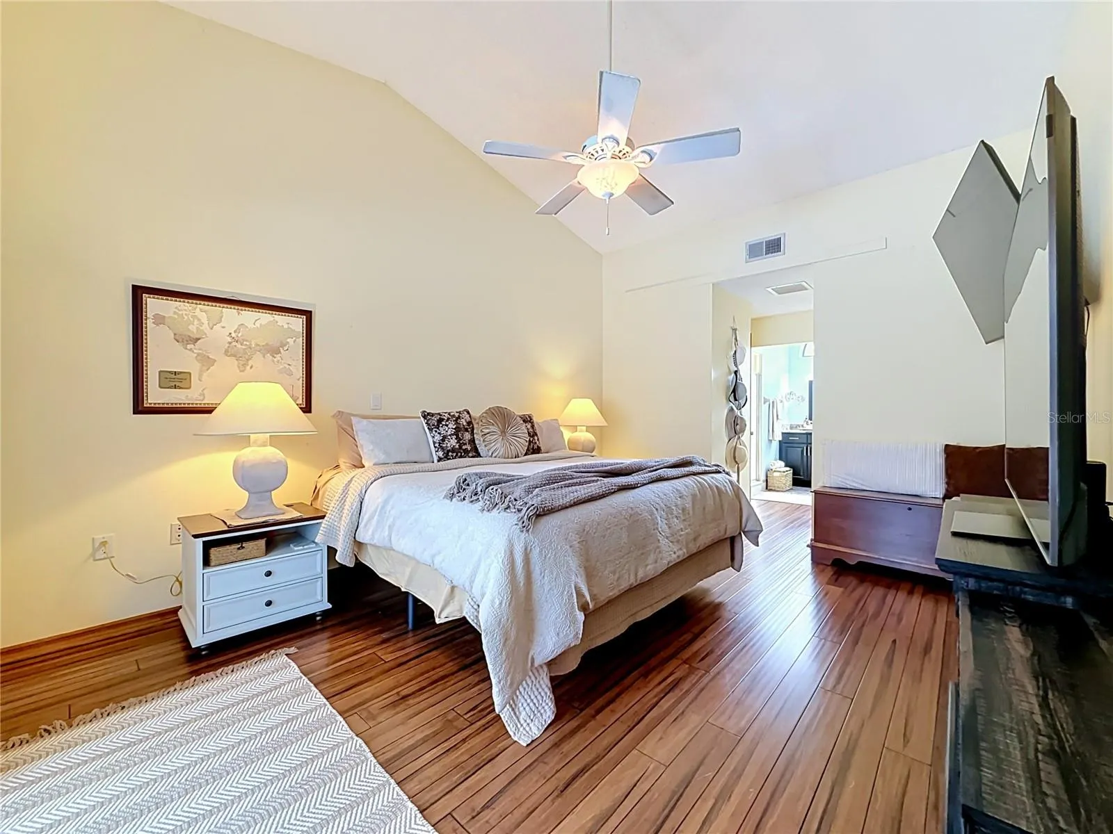 Primary bedroom with high ceiling