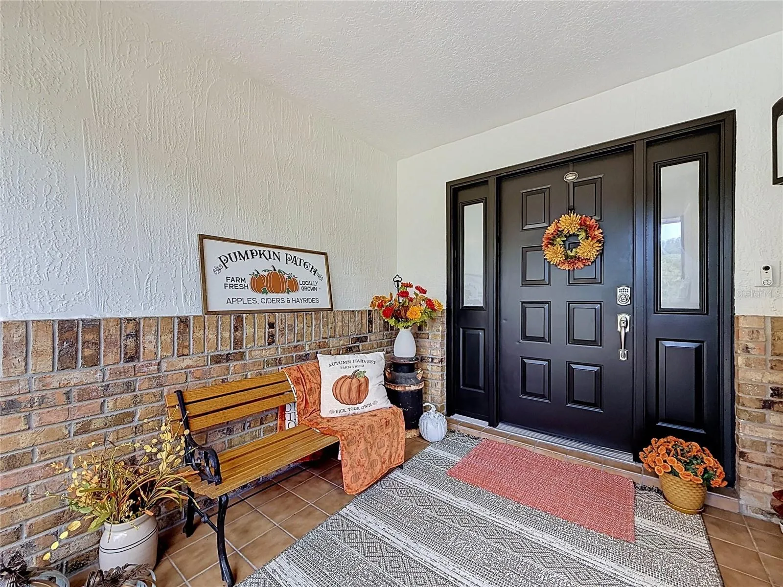 inside the front screened in porch, beautifully front doors