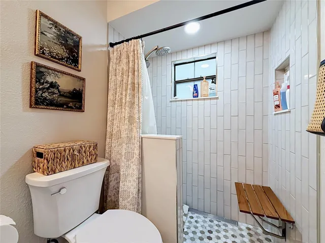 Guest bathroom has a walk in shower