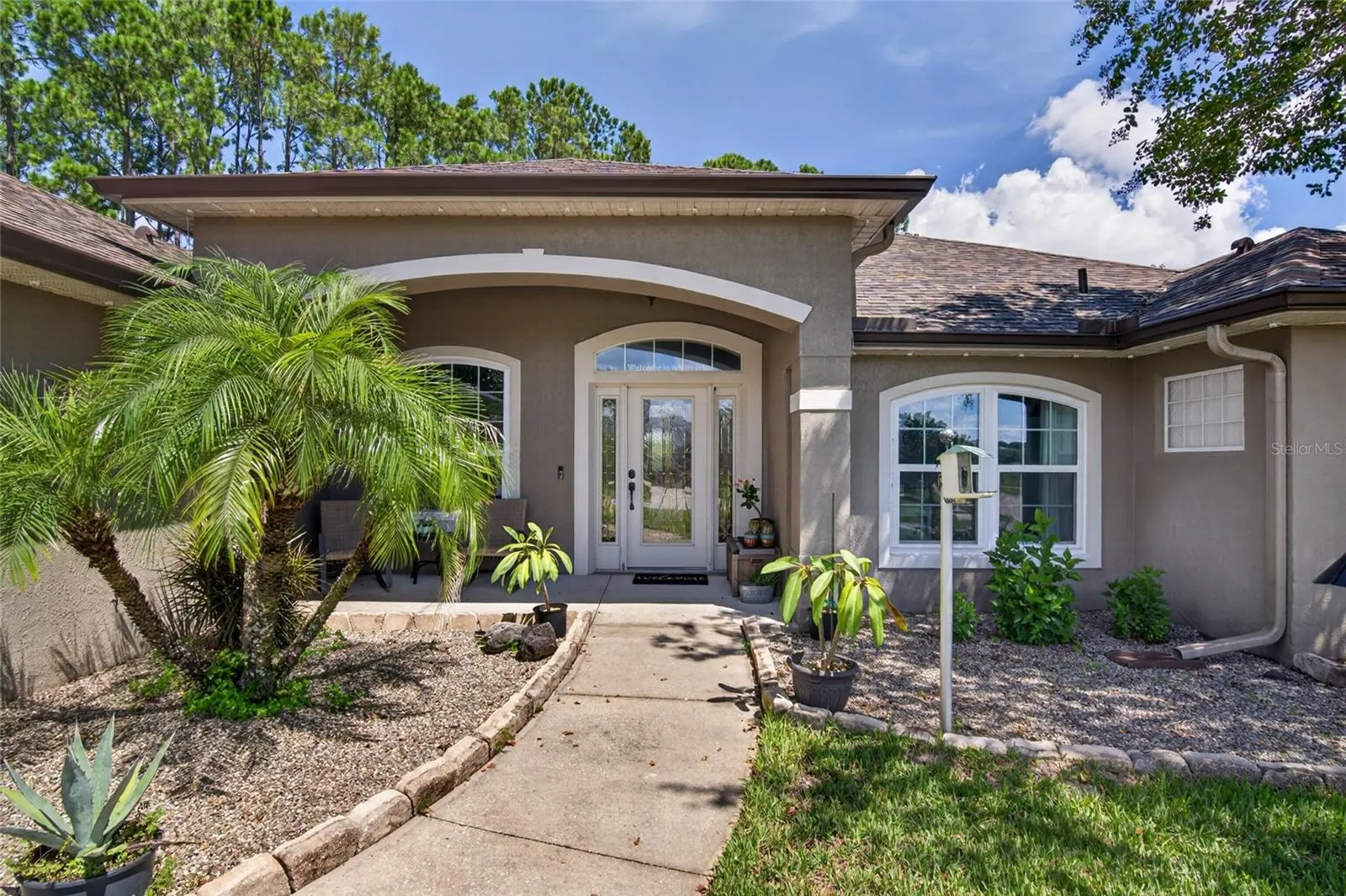 Landscaped front walkway and covered front porch
