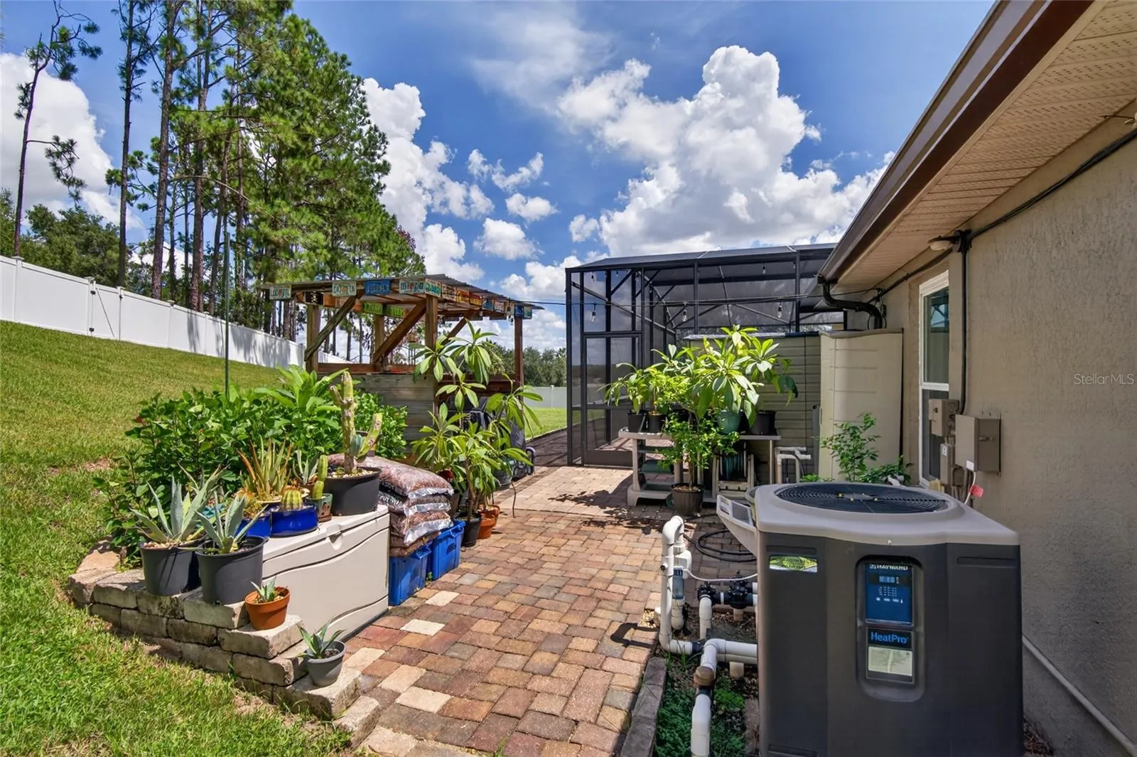 Grill gazebo and pool equipment area (pavered)