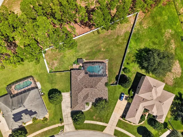 Aerial of entire property (no immediate rear neighbor; trees owned and maintained by HOA)