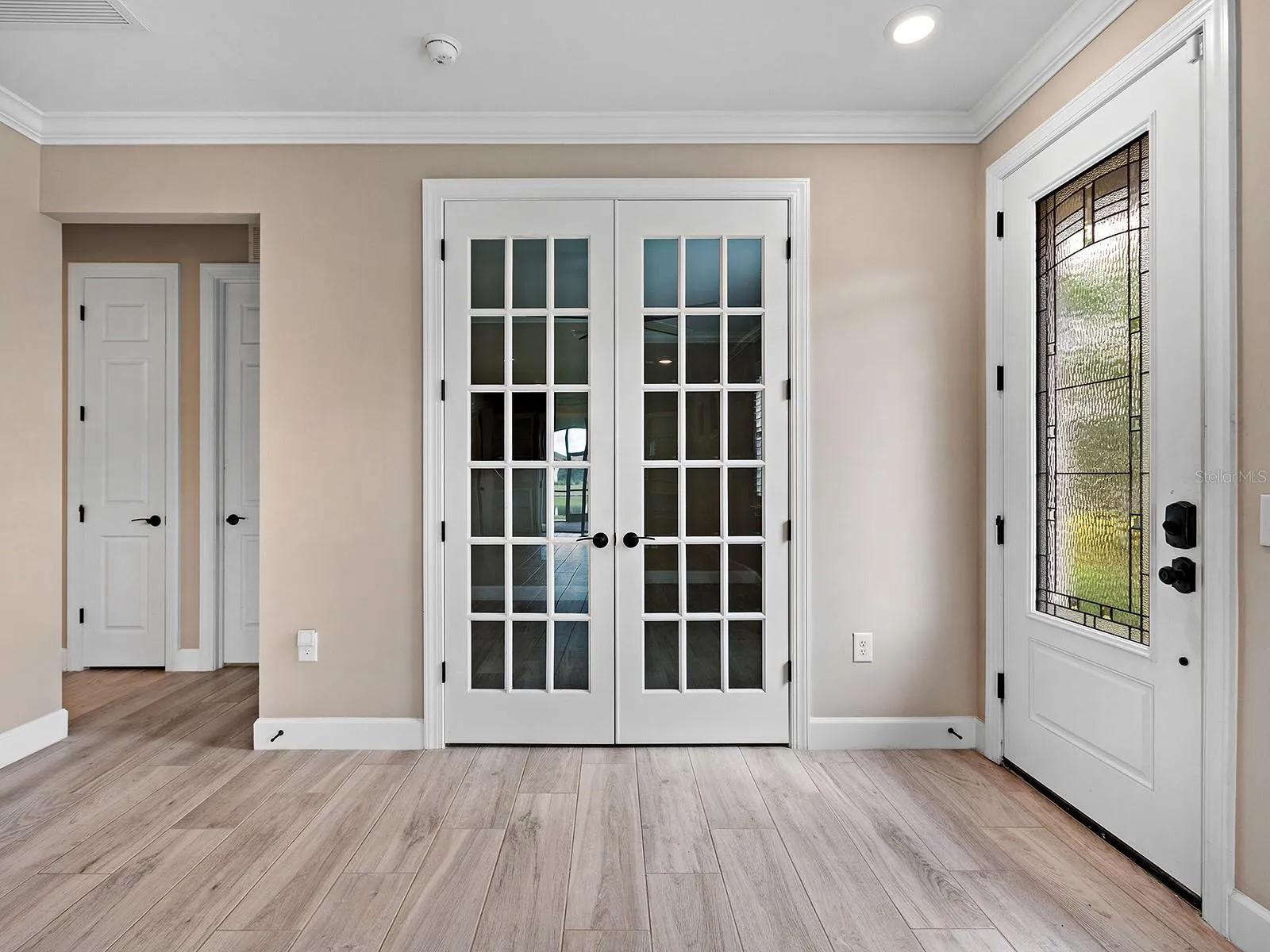 Side Entry showing den with doors closed