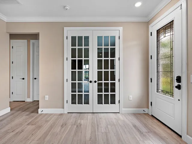 Side Entry showing den with doors closed