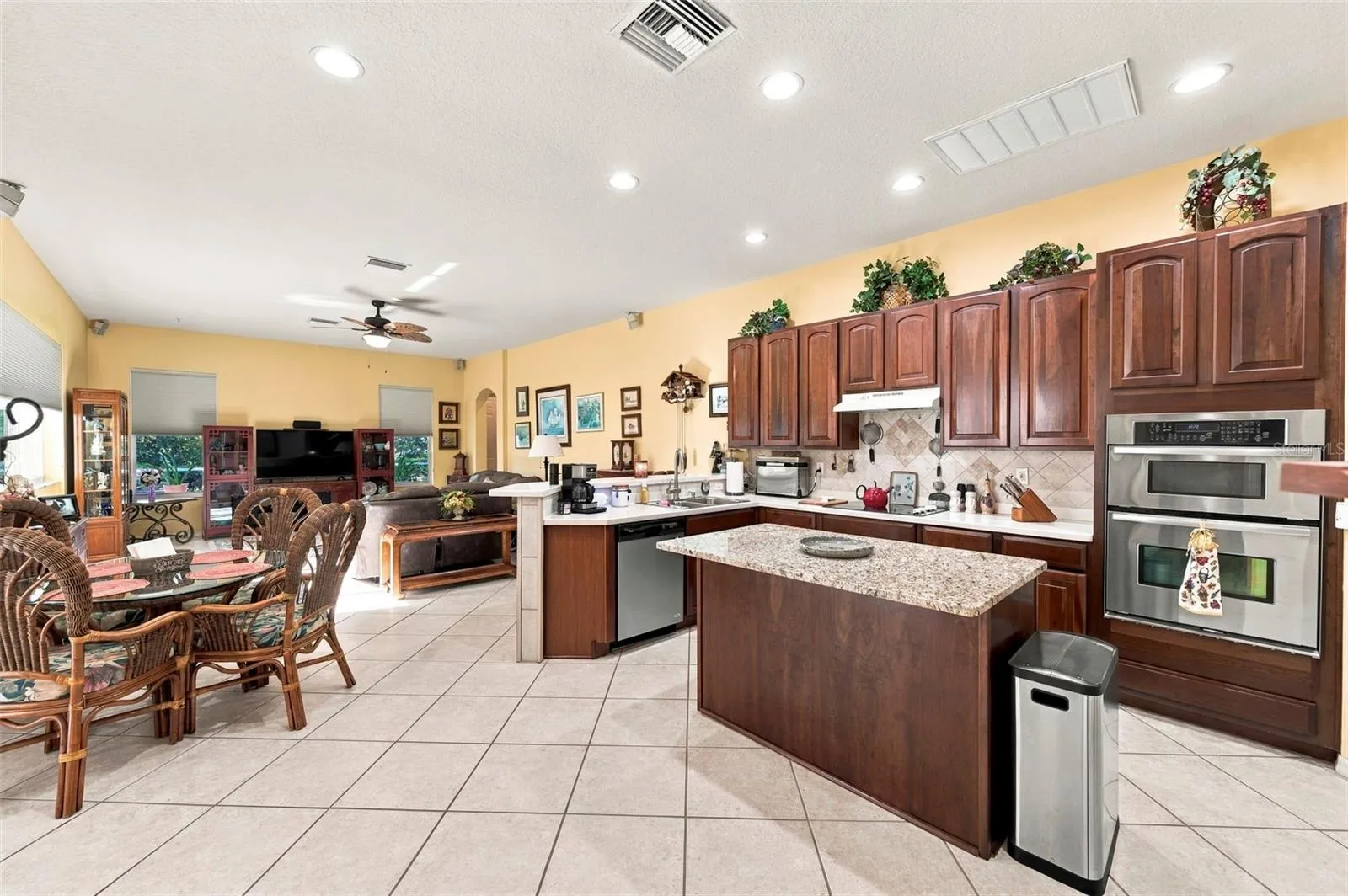 Open concept kitchen - stainless appliances with island