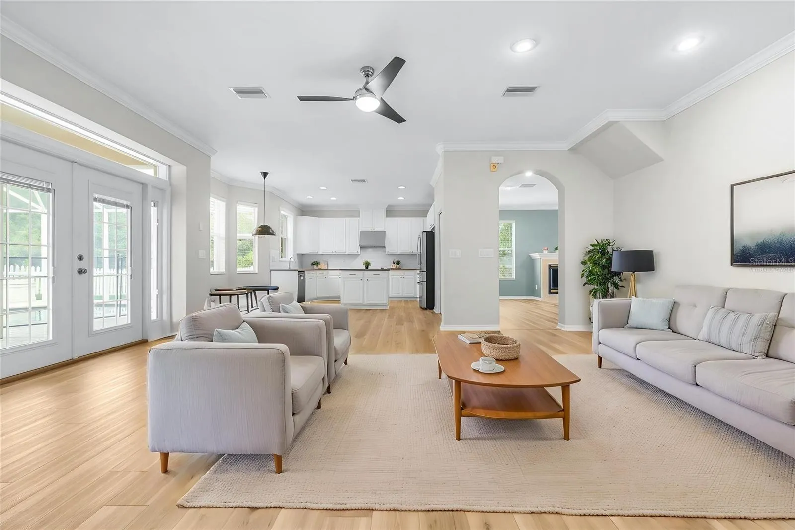 Virtually staged family room with adjoining eat-in kitchen area