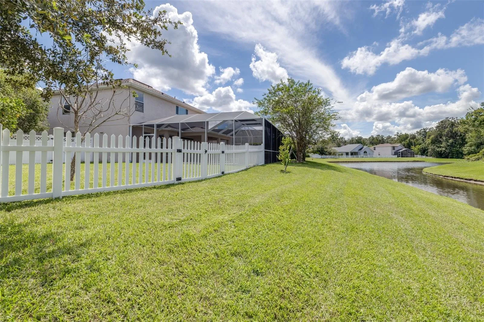 Back of home with private pond and conservation view
