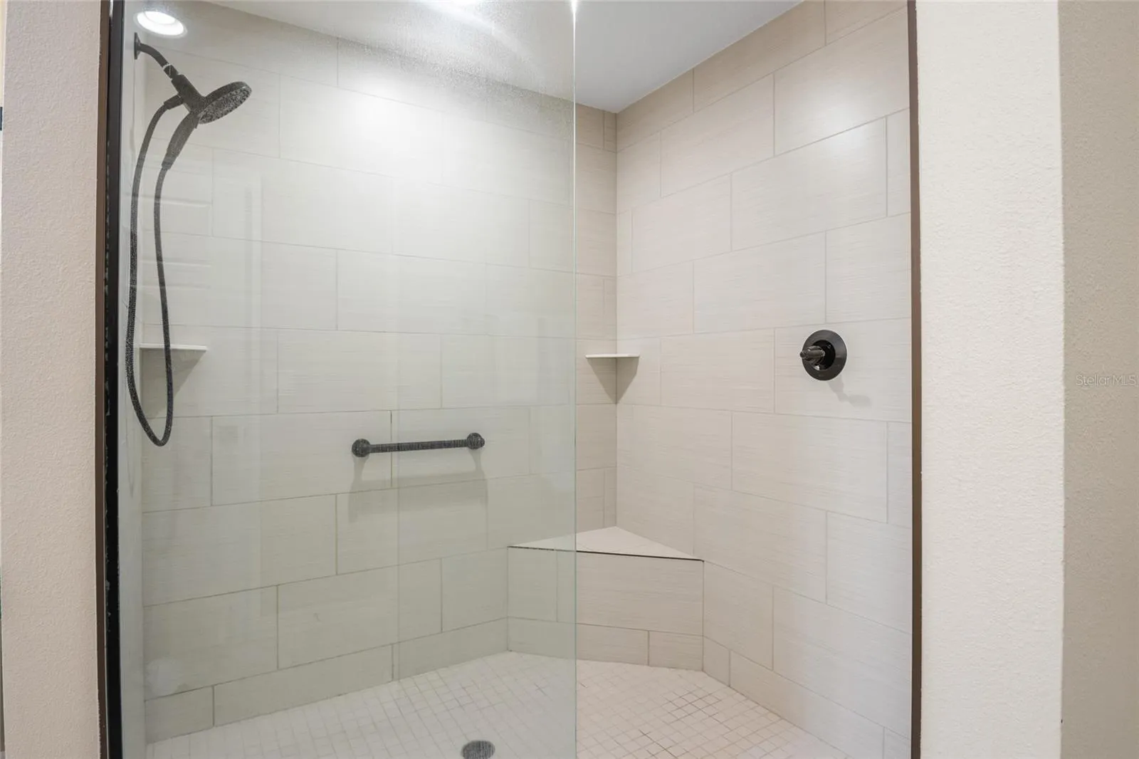 Walk in shower with seat.