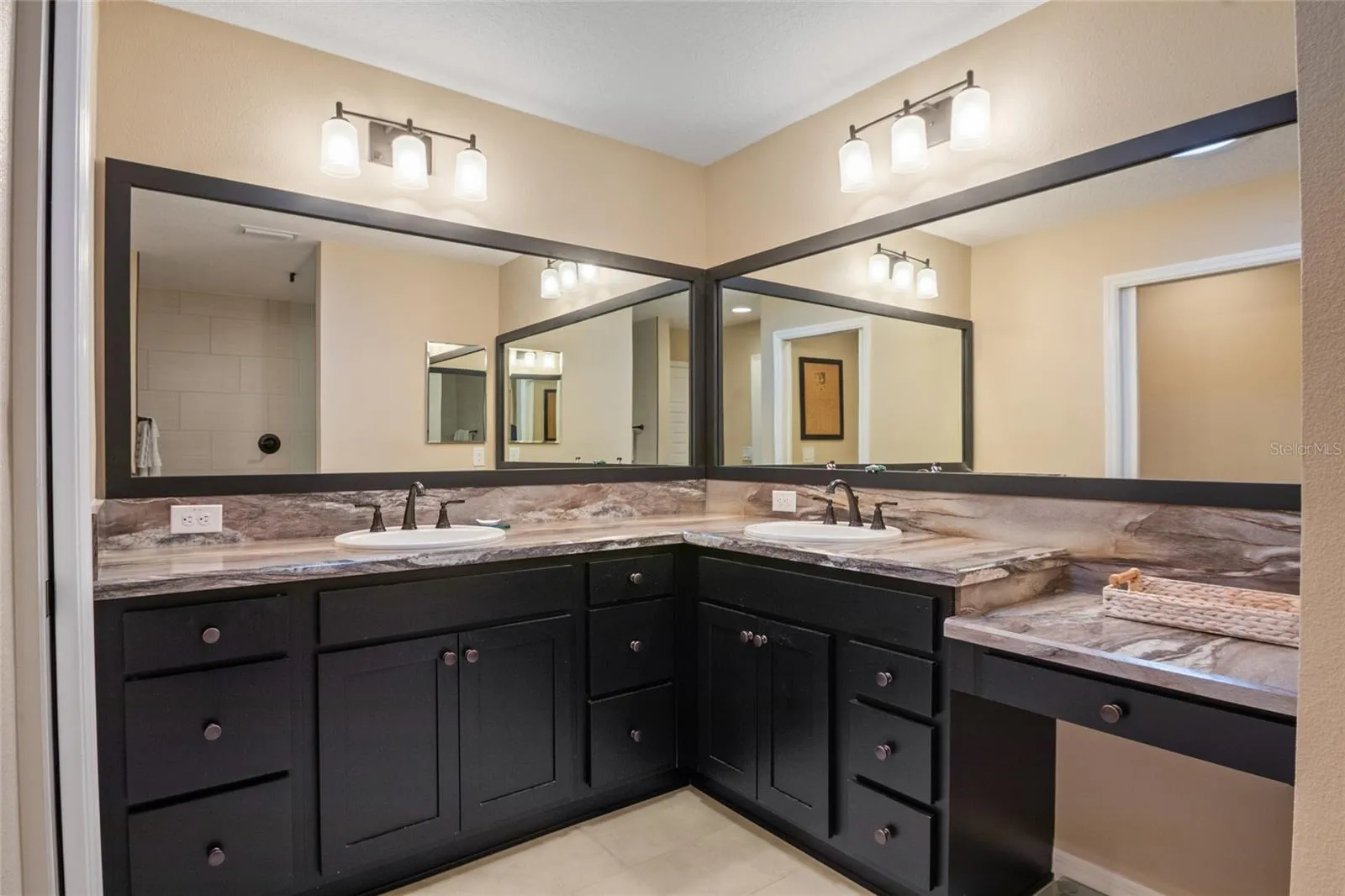 Split vanity with dual sinks.  Separate make up vanity.