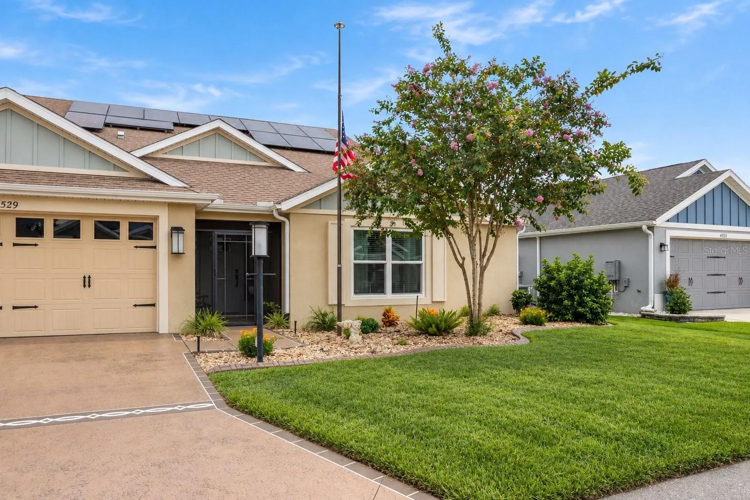Screened in front entry, low maintenance landscaping.