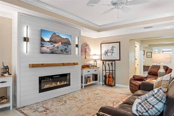 Trey ceilings in main area with decorative crown molding.