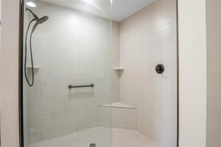 Walk in shower with seat.