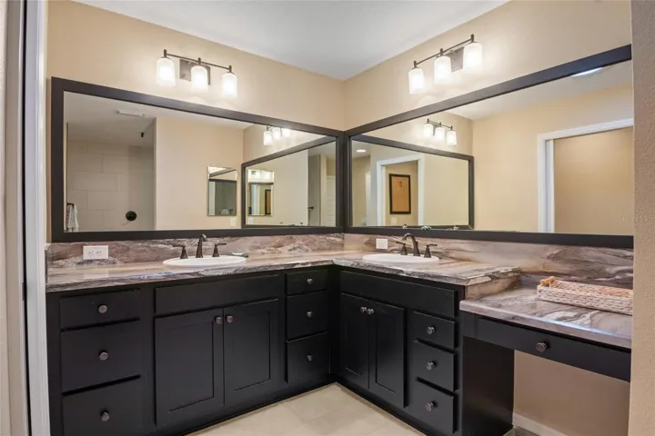 Split vanity with dual sinks.  Separate make up vanity.