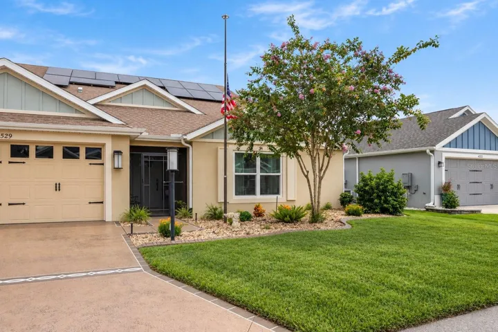 Screened in front entry, low maintenance landscaping.