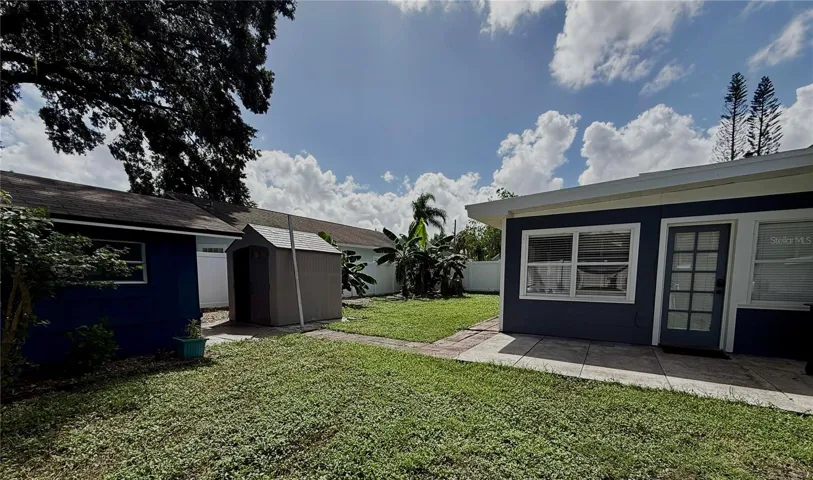 Fenced Backyard with storage sheds