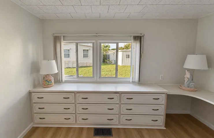 built in dressers and desk area