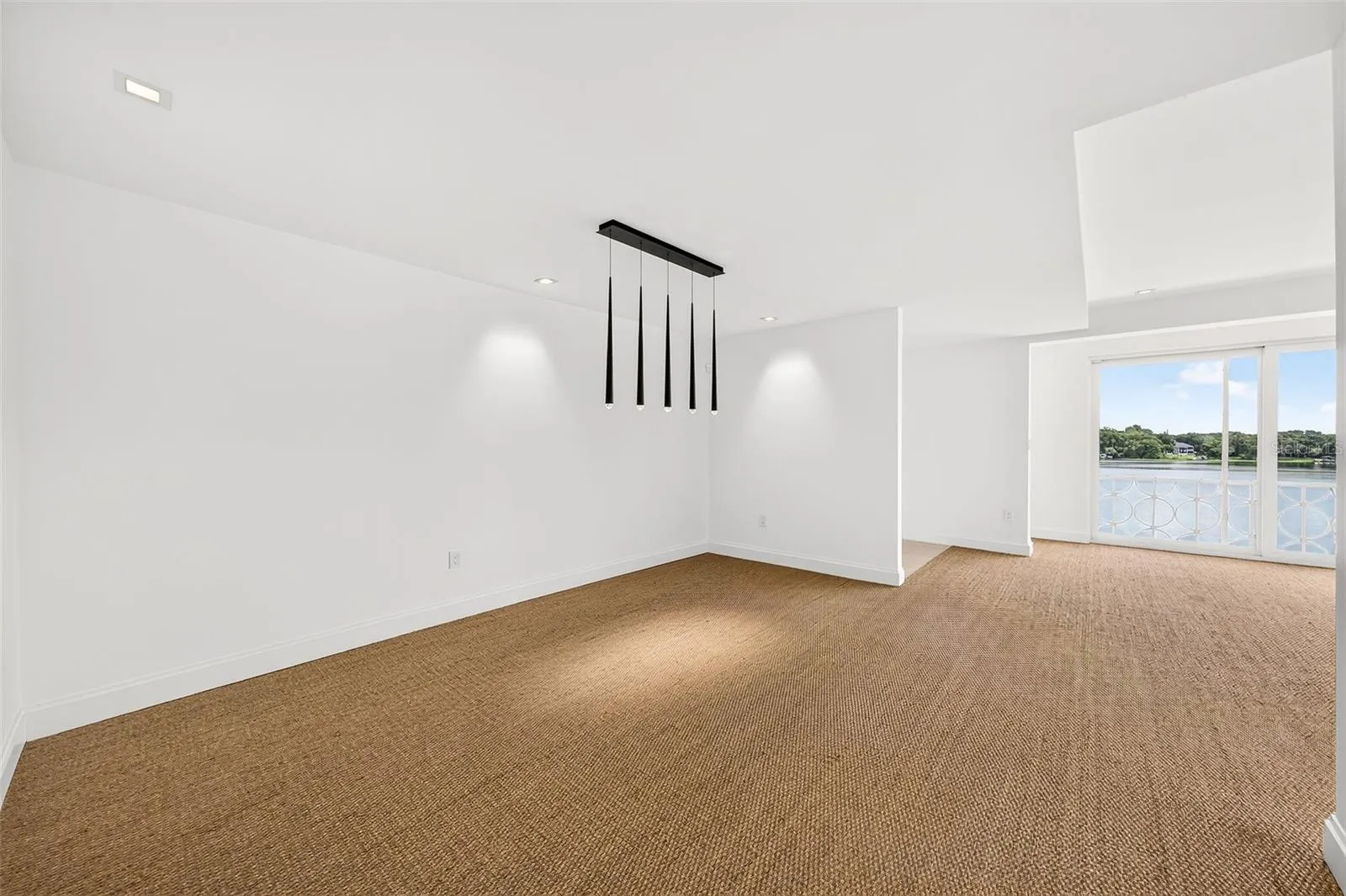 Dining Area Opens to Living Room and Lake View